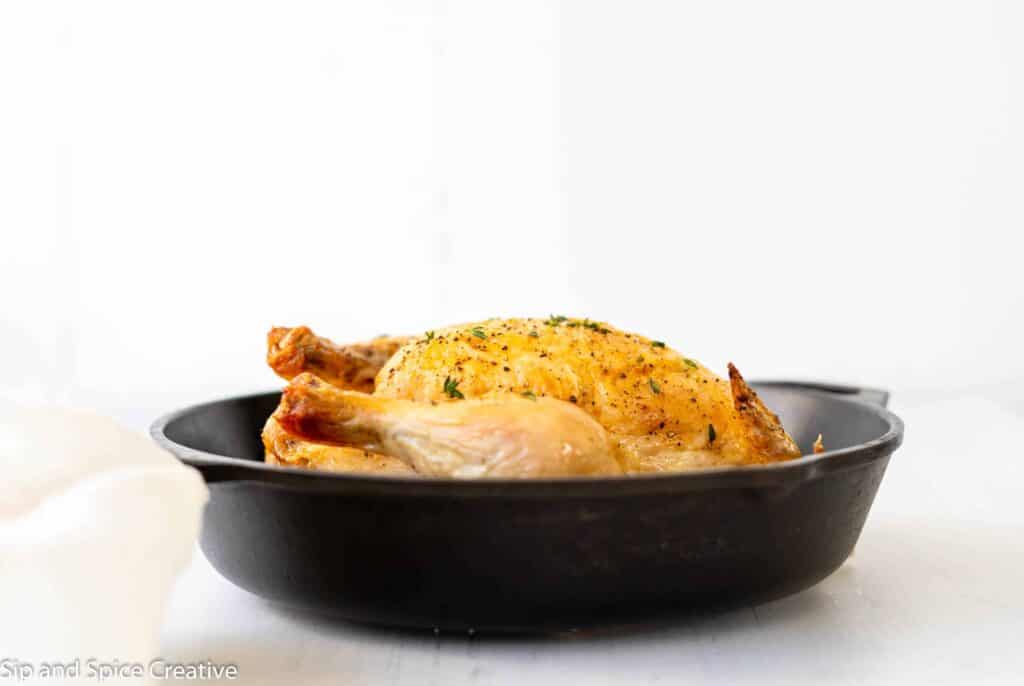 roast chicken in a skillet at eye level
