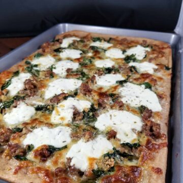 sausage spinach and ricotta pizza on whole wheat crust
