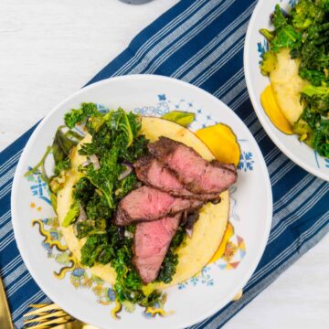 Cheesy Polenta with Grilled Steak and Garlicky Greens | Sip + Spice