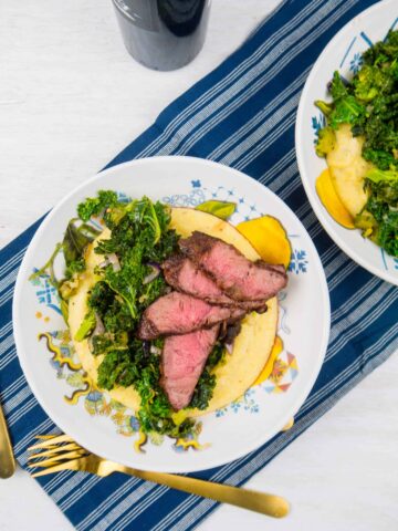 Cheesy Polenta with Grilled Steak and Garlicky Greens | Sip + Spice