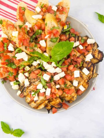 Platter of Grilled Chicken with Bruschetta and mozzarella