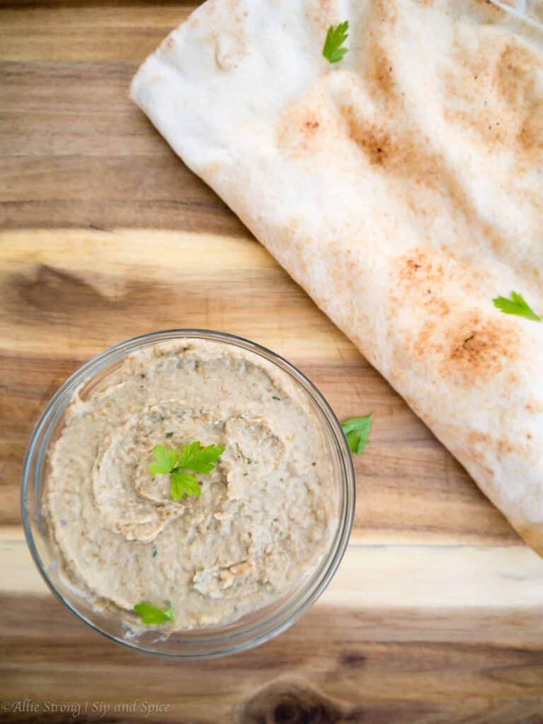 This Classic Baba Ganoush will turn even the most adamant eggplant haters into lovers! | Sip and Spice #babaganoush #dip #sidedish #partyfood #dippablefood #eggplant #vegan #vegetarian