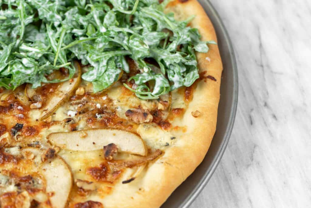 Caramelized Onion, Gorgonzola and Pear Pizza with Arugula | Sip and Spice