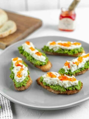 Pea Pesto Crostini with Ricotta and Red Pepper Jelly | Sip and Spice
