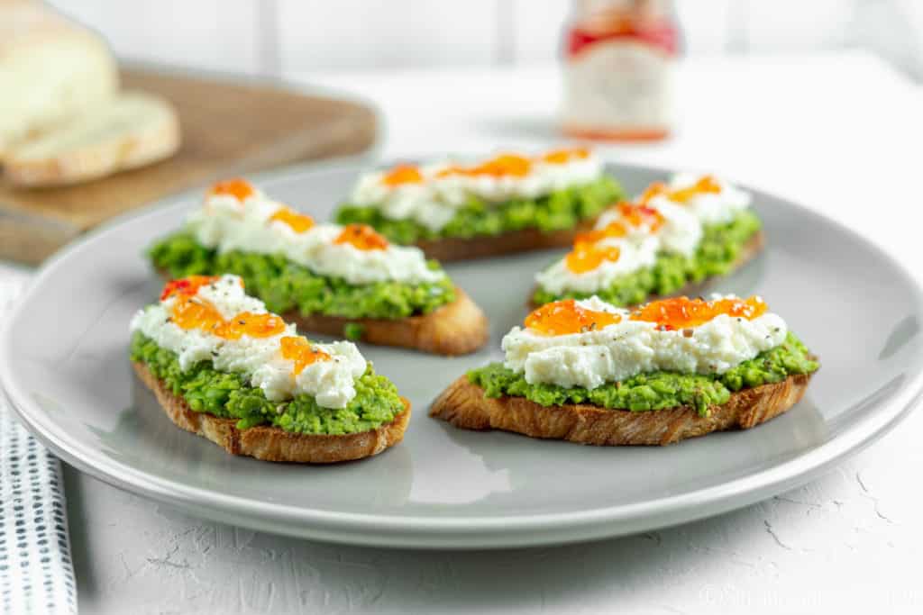 Pea Pesto Crostini with Ricotta and Red Pepper Jelly | Sip and Spice