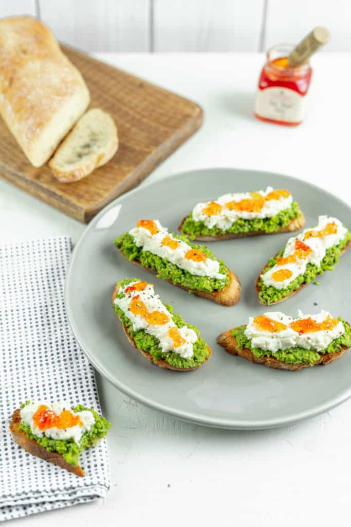 Pea Pesto Crostini with Ricotta and Red Pepper Jelly | Sip and Spice