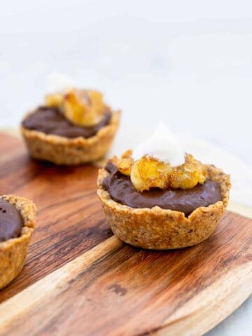 Vegan Chocolate Banana Tarts on wooden serving board