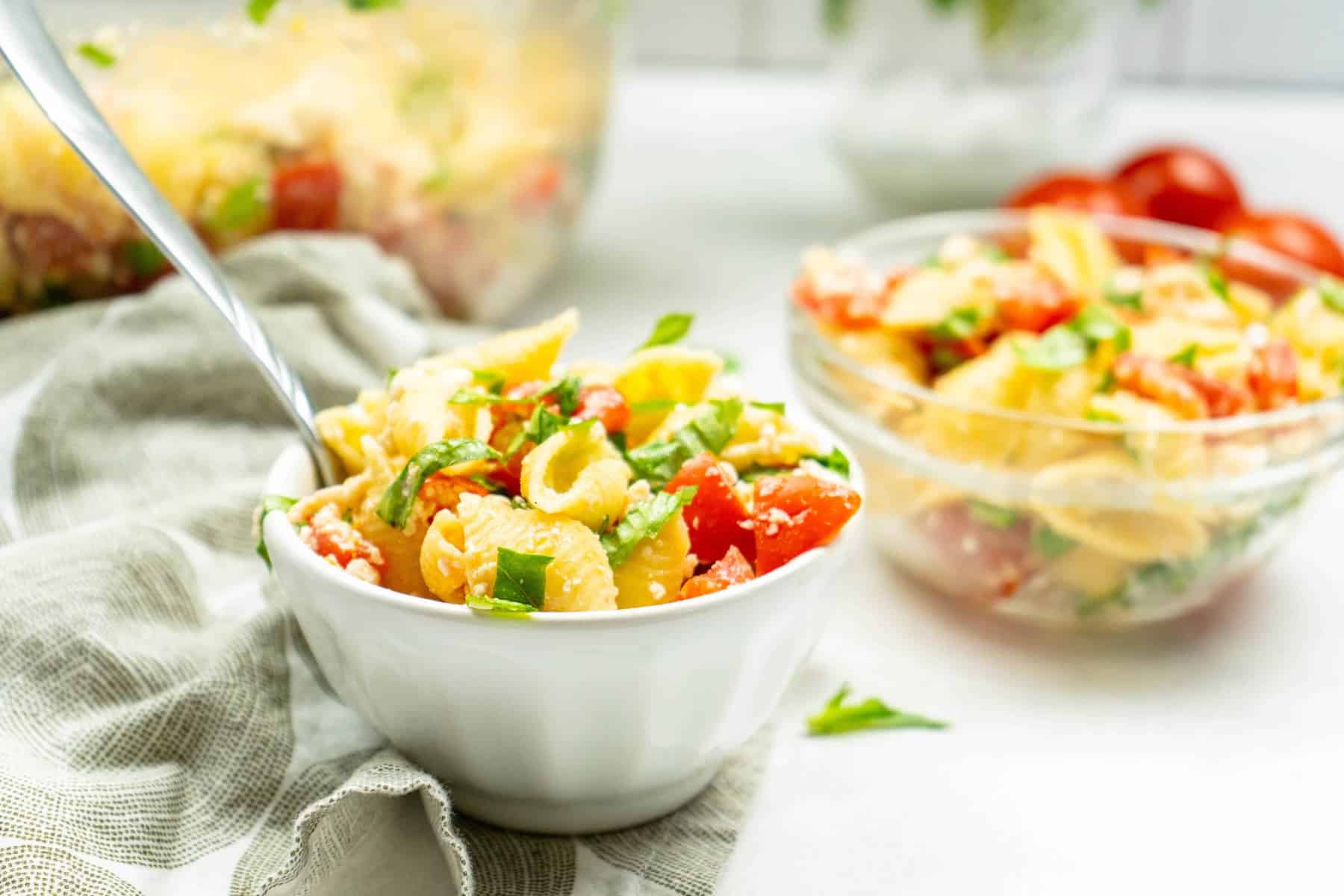 It's a super simple pasta salad made with shell pasta, fresh tomatoes,...