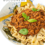 Veggie Bolognese in pasta bowl with gold fork