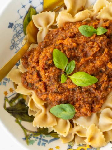 Final Image Veggie Bolognese with Fresh Basil on Chickpea Pasta