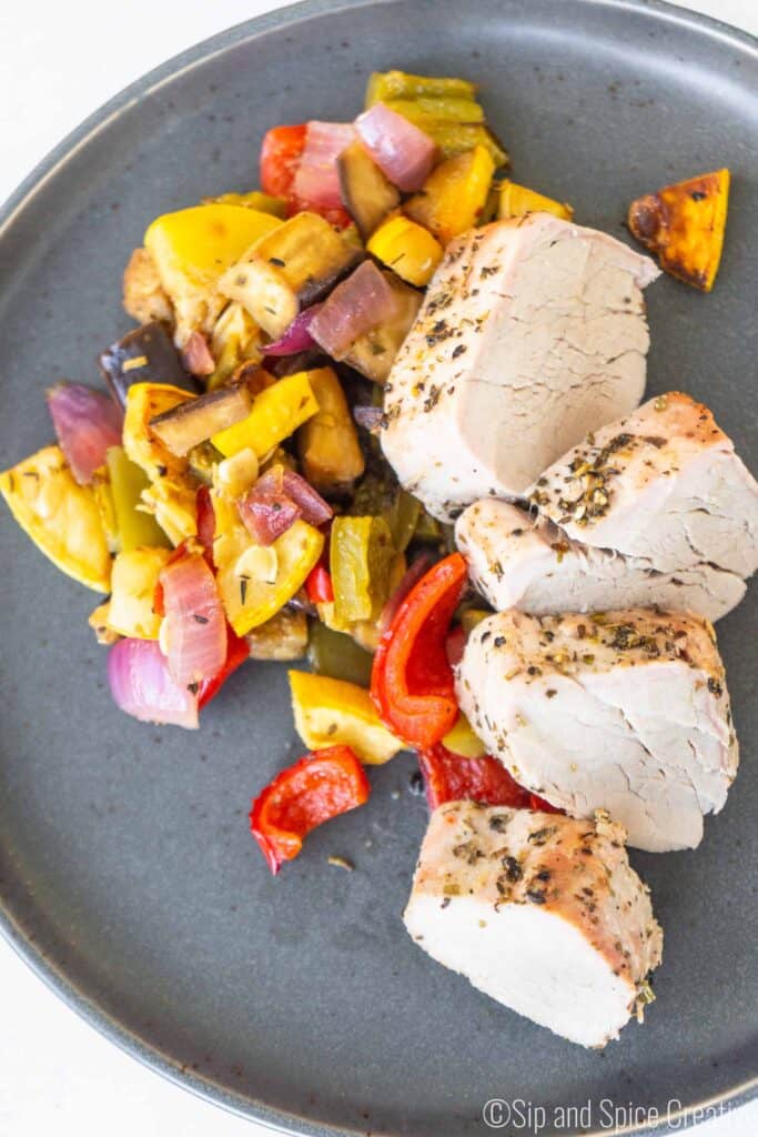 sliced pork tenderloin with rainbow roasted vegetables